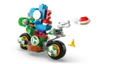 Blue Yoshi launches red shell from bike.