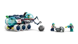 Minifigures examining a splitting rock next to a rover.