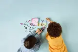 Children building LEGO DREAMZzz set.