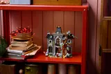 Mayor Manor on a shelf, front view.