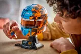Person admiring F1 helmet.