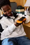 Boy examining McLaren W1.