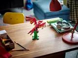 LEGO phoenix on a desk.