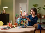 Child interacting with Monkie Kid City.
