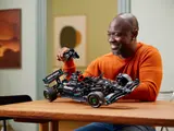 Man interacting with F1 W14 E Performance.