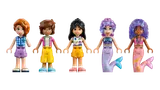 Five LEGO Friends minifigures, human and mermaid.