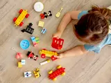 Child playing with DUPLO parts.