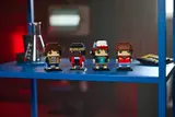 BrickHeadz on a blue shelf.