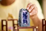 Holding the purple geode.