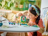 Girl customizing LEGO photo frame.