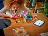 Child building with digital instructions.