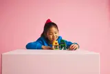 Child playing with Moana's Island set.