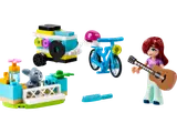 LEGO Friends Autumn minifigure with guitar, bike, music trailer, and bunny habitat.