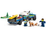 Police truck rear, trailer, officer, dogs, trainer.