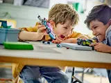 Kids playing with modified LEGO cars.