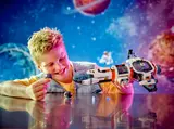 Child playing with spaceship.