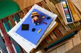 Monkey D. Luffy pieces on books.