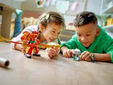 Children playing with Monkie Kid mech.