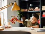 Child playing with mech.