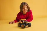 Boy playing with DIGatron.