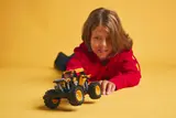 Boy pulling back the DIGatron.