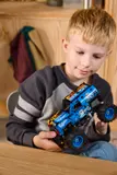 Child holding split Fire & Ice Grave Digger.
