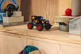 Fire-themed Grave Digger on display.
