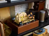 Diorama on a dark shelf.