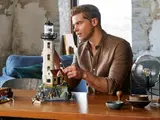 Man assembling the lighthouse cottage.