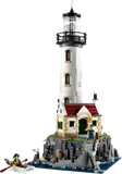 LEGO Ideas Motorized Lighthouse on a rocky outcrop with minifigures.