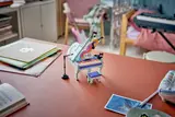LEGO piano displayed in room.