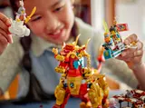 Child playing Monkie Kid minifigures.