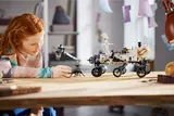Child playing with Rover model.