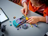 Child building LEGO Camaro ZL1.