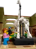 Close-up of dinosaur skeleton with minifigures.
