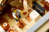 Cleaner minifigure sweeping inside.
