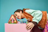 Girl admiring the LEGO Glamping Cabin.