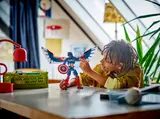 Child playing with Captain America figure.