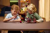 Children playing with LEGO DREAMZzz 71513 set.