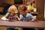 Children playing with LEGO DREAMZzz 71513 minifigures and models.