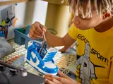 Builder showing keychain feature on LEGO Nike Dunk.