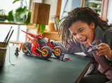 Child playing with Ninjago vehicle.