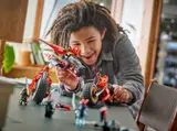 Child playing with Ninjago jet.