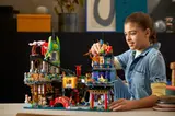 Girl playing with LEGO Ninjago City Markets set.