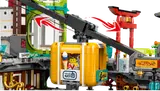 Close-up of yellow cable car with minifigure in LEGO Ninjago City Markets.