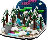 LEGO Northern Lights diorama with snow, trees, and aurora borealis.