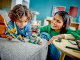 Child playing with Ninjago 71798 dragon.
