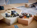 Complete LEGO City 60449 set displayed on boxes.