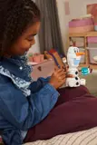 Child holding LEGO Olaf