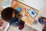 Child building with tablet